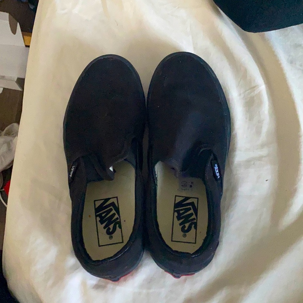 Black slip on vans.